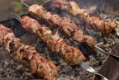 Shashlik cooking on an outdoor grill 