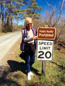 Here's Susan at a sign we found in the woods. 